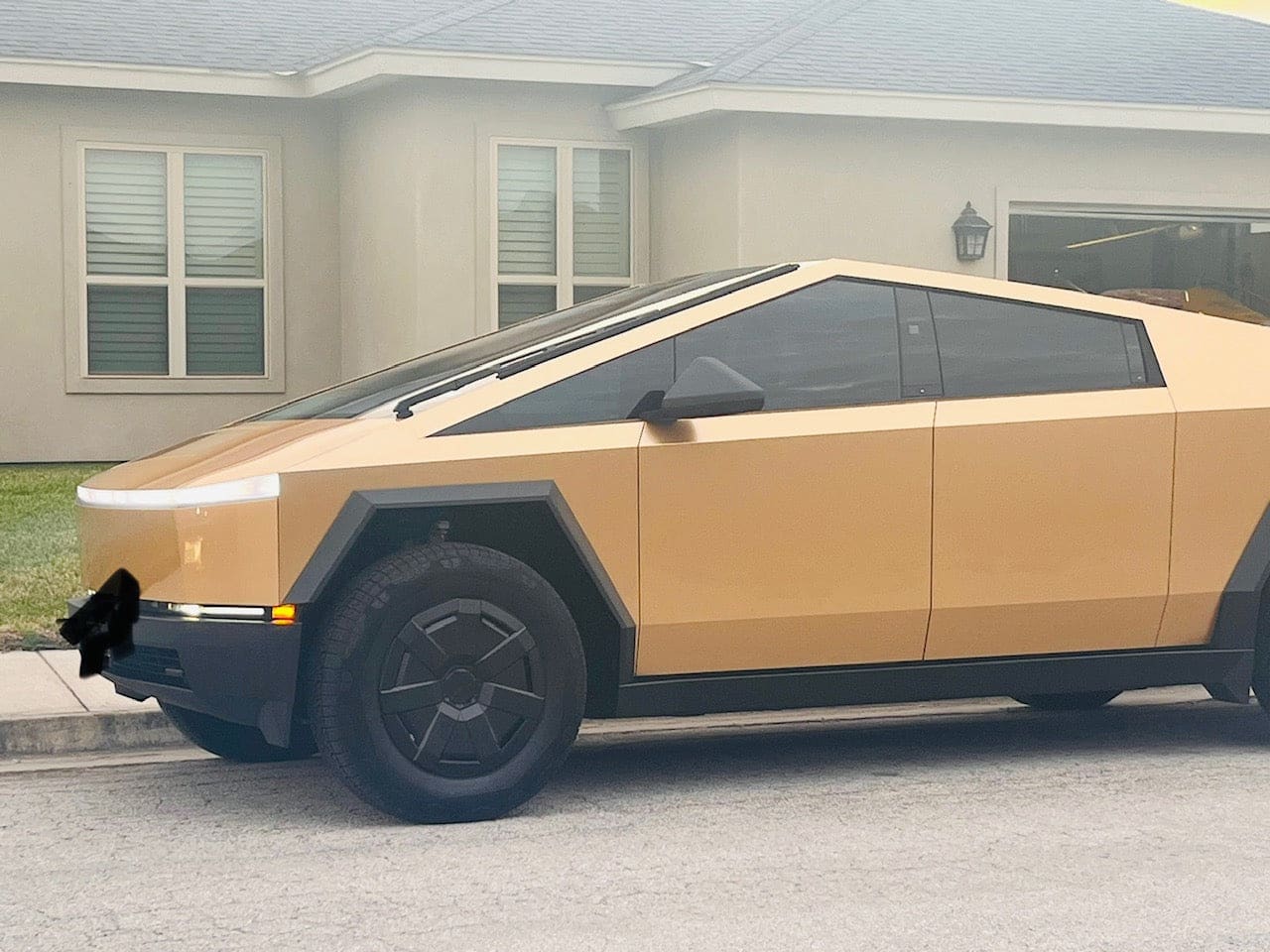 gold-colored tesla cybertruck milan gold color ppf