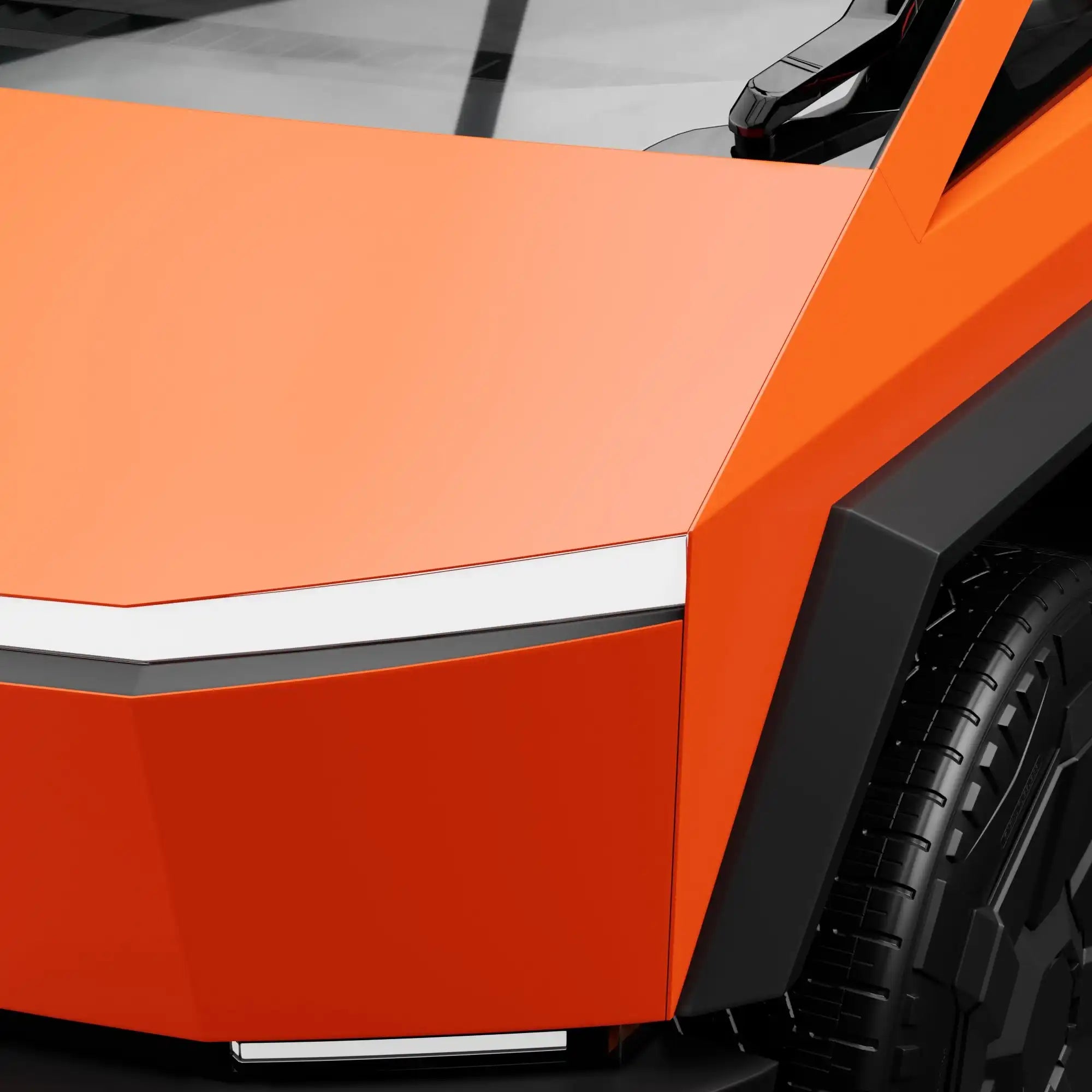 Angular orange vehicle panel with black trim and a visible tire.