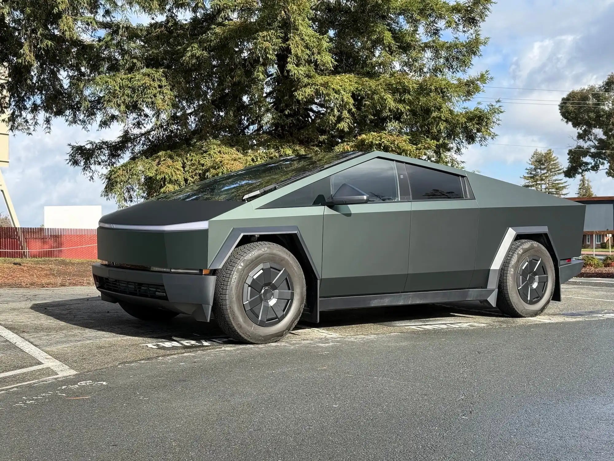 Tesla Cybertruck parked in matte gray finish.