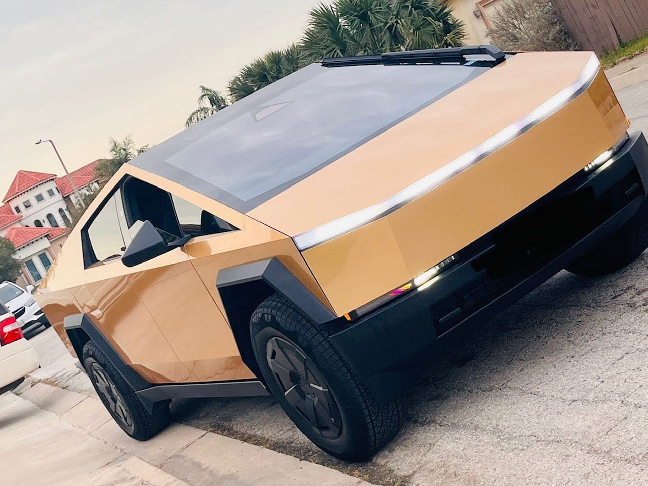 gold-wrapped tesla cybertruck milan gold color ppf
