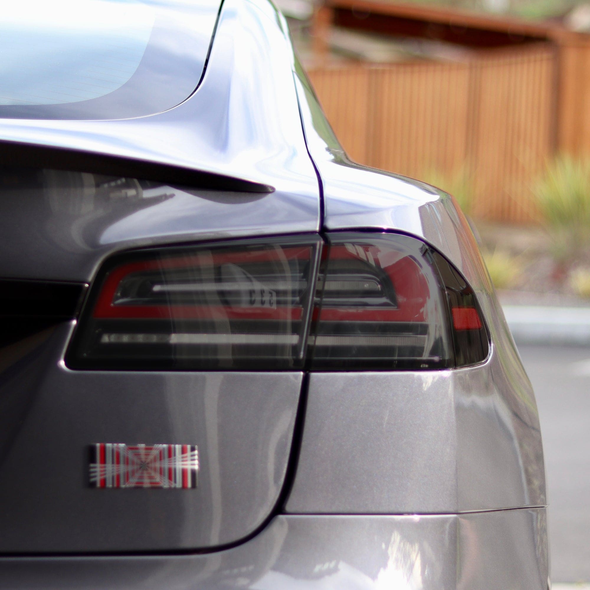 gray car’s rear tinted taillights tesla model tail lights smoke tint ppf